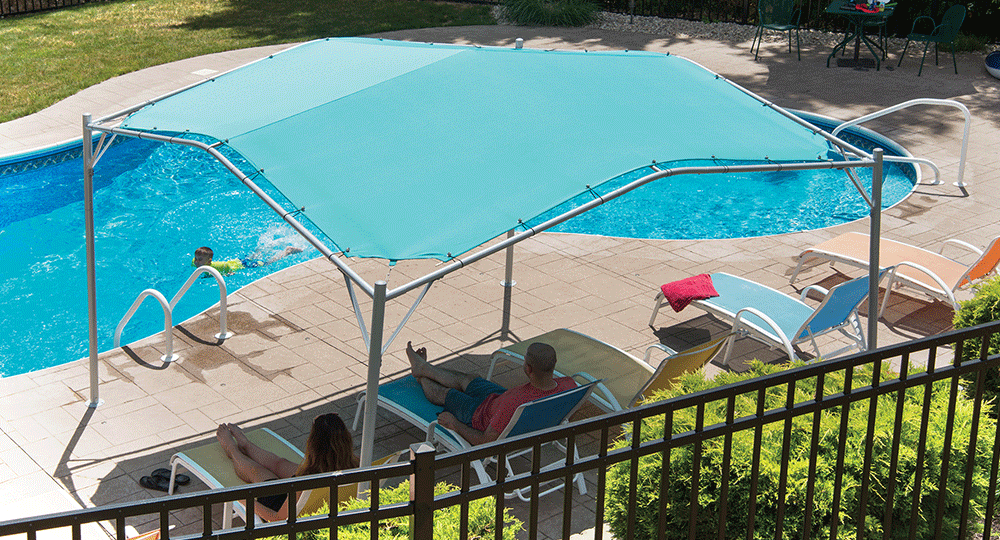 A canopy tent next to a swimming pool