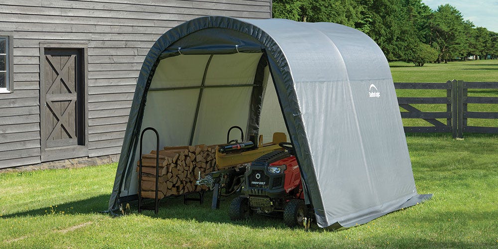 Lawnmower and Firewood inside a Portable Shed